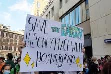 Students marching in Milan for the pre-cop26 at Fridays for Future rally. The sign in the middle says "Save the Earth, is the only place with parmigiana". Picture taken on the 1st of October in 2021. 2021-10-01